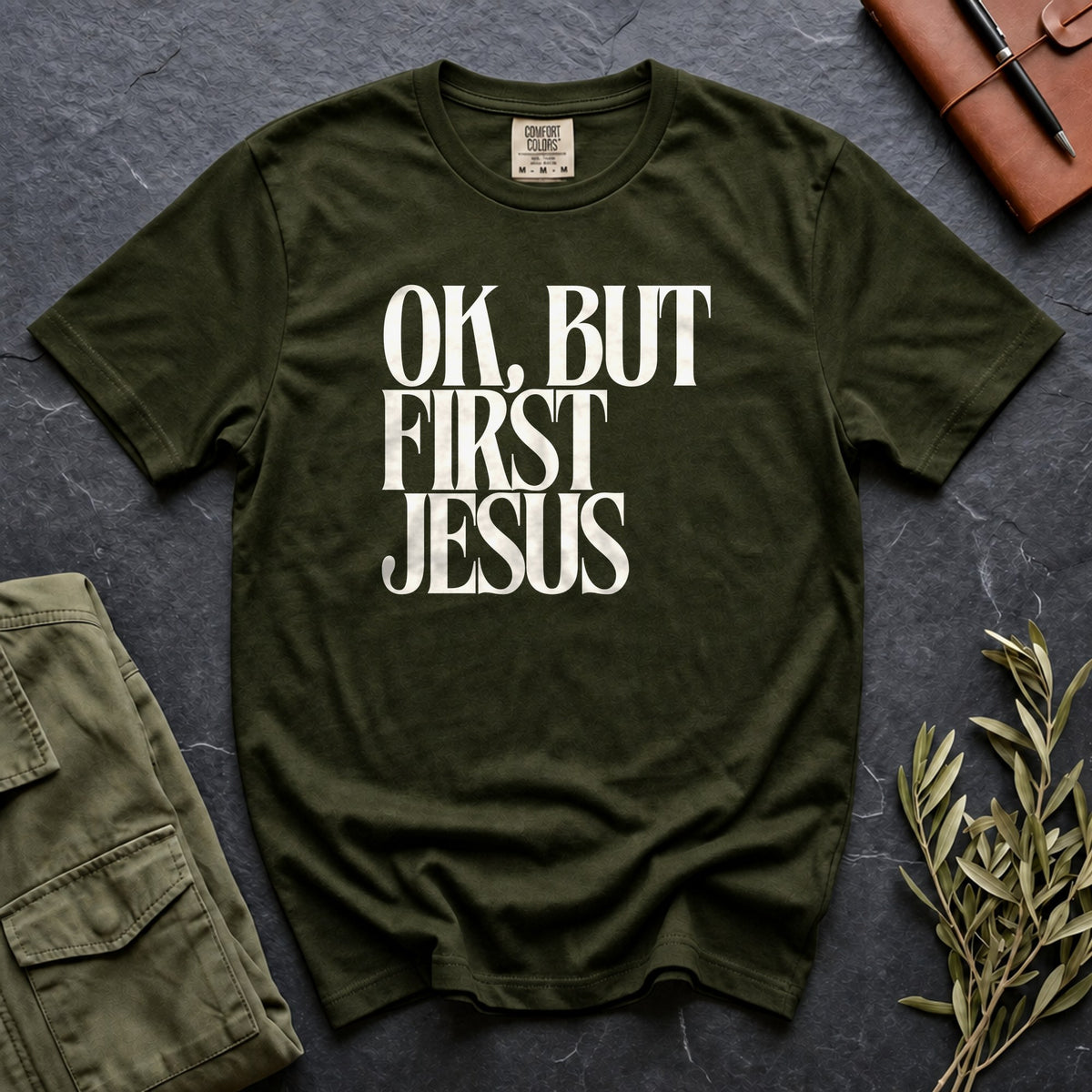 OK, But First Jesus Comfort Colors 1717 tee in Moss