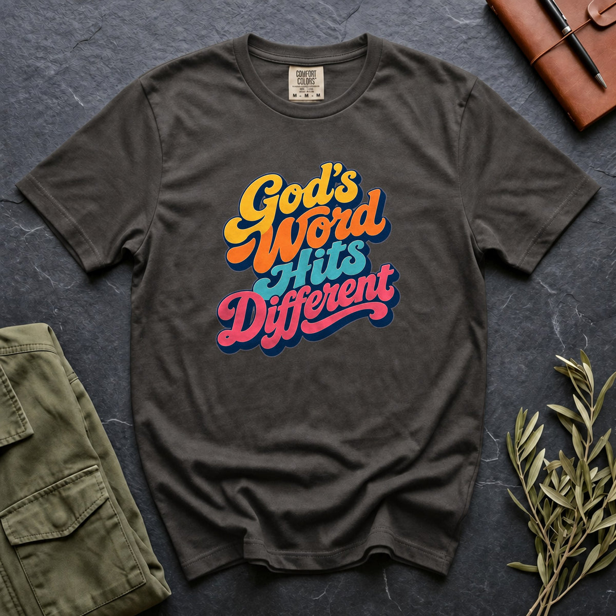 God's Word Hits Different Comfort Colors 1717 tee in Pepper