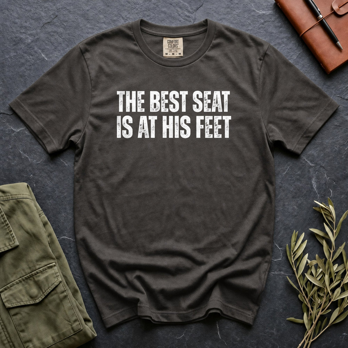 The Best Seat Is at His Feet Comfort Colors 1717 tee in Pepper