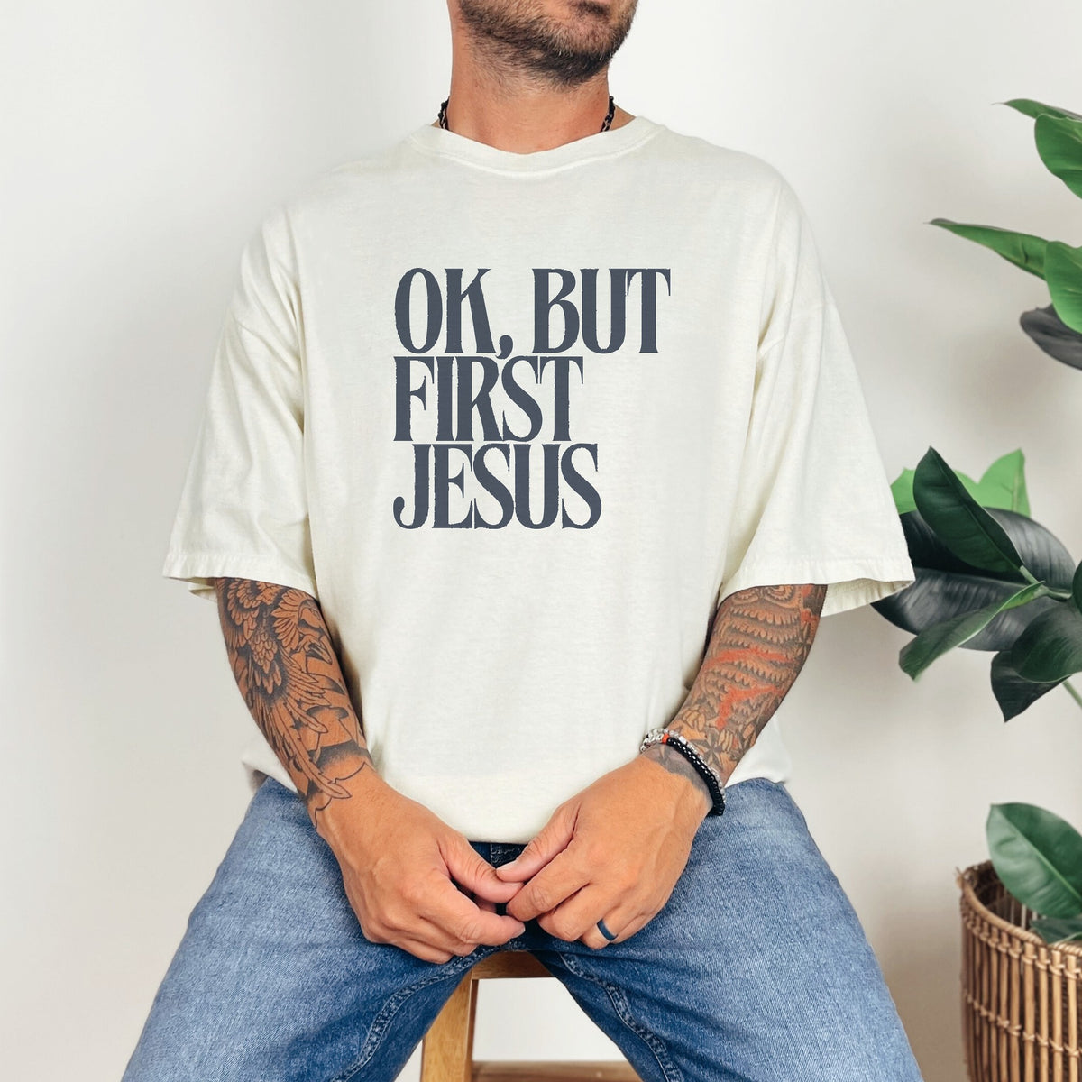 Man wearing OK, But First Jesus tee in Ivory